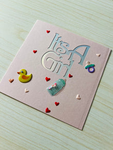 It's a Girl Greeting Card: Rubber Ducky, Baby Bottle Accents