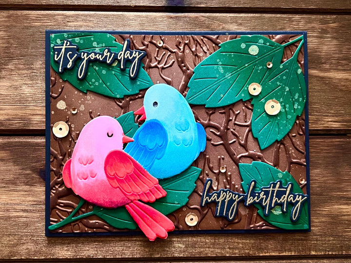 Red and Blue Bird Duo and Forest Leaves It's Your Day Happy Birthday Card