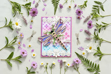 Floral Dragonfly card flat on white marble with fresh wildflowers and dragonfly specimens